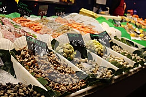 Seafood price tags, Shellfish, shrimp, fish, at Boqueria Market in Barcelona, Ã¢â¬â¹Ã¢â¬â¹Spain